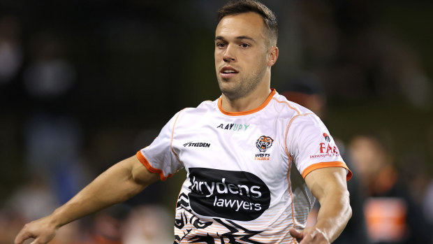 Luke Brooks warms up before the Wests Tigers' round match against the Canberra Raiders.