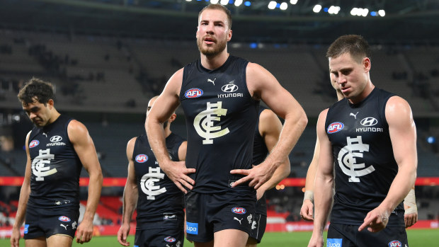 MELBOURNE, AUSTRALIA - AUGUST 27: Harry McKay and his Blues team mates look dejected after losing the round 24 AFL match between Carlton Blues and Greater Western Sydney Giants at Marvel Stadium, on August 27, 2023, in Melbourne, Australia. (Photo by Quinn Rooney/Getty Images)