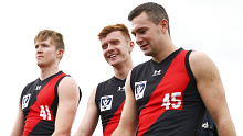 MELBOURNE, AUSTRALIA - MARCH 09: Cian McBride, Ross McQuillan and Conor McKenna of the Bombers (R) walk off after competing in the VFL curtain-raiser match before the Marsh Community Cup AFL match between the Geelong Cats and the Essendon Bombers at Central Reserve on March 09, 2020 in Melbourne, Australia. (Photo by Daniel Pockett/Getty Images)