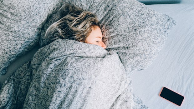 Woman sleeping in bed 