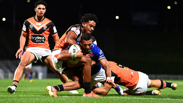 Marcelo Montoya of the Warriors dives over of the Tigers score a try during the NRL trial match between New Zealand Warriors and Wests Tigers at Mt Smart Stadium on February 09, 2023 in Auckland, New Zealand. (Photo by Hannah Peters/Getty Images)