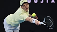 Jannik Sinner of Italy plays a backhand against Alexander Zverev of Germany in the Men's Singles Final during day 15 of the 2025 Australian Open at Melbourne Park on January 26, 2025 in Melbourne, Australia. (Photo by Quinn Rooney/Getty Images)