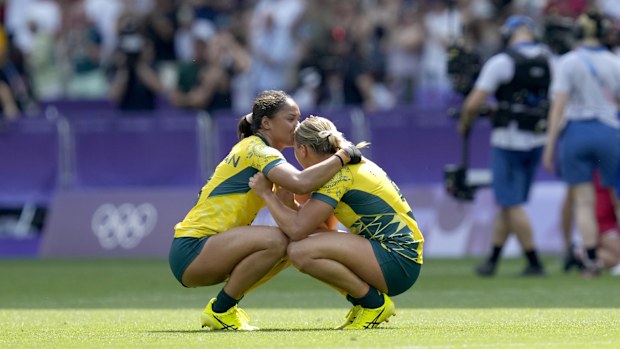 Australia's Faith Nathan, left and teammate Australia's Teagan Levi react on the pitch after loosing the women's semifinal