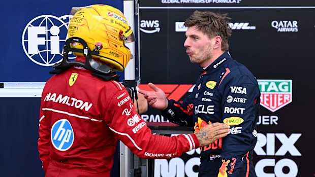 Fourth placed qualifier Lewis Hamilton of Great Britain and Scuderia Ferrari and Fifth placed qualifier Max Verstappen of the Netherlands and Oracle Red Bull Racing talk in parc ferme during qualifying ahead of the F1 Grand Prix of Monaco at Circuit de Monaco on May 24, 2025 in Monte-Carlo, Monaco (Photo by Mark Sutton - Formula 1/Formula 1 via Getty Images)