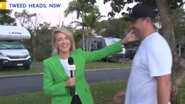 She then gestures for her husband Paul to join her on the tele.