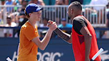 Nick Kyrgios shakes hands with Jannik Sinner after being defeated in the fourth round of the 2022 Miami Open.