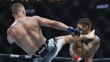 Jul 29, 2023; Salt Lake City, Utah, USA; Dustin Poirier (red gloves) fights Justin Gaethje (blue gloves) during UFC 291 at Delta Center. Mandatory Credit: Jeff Swinger-USA TODAY Sports