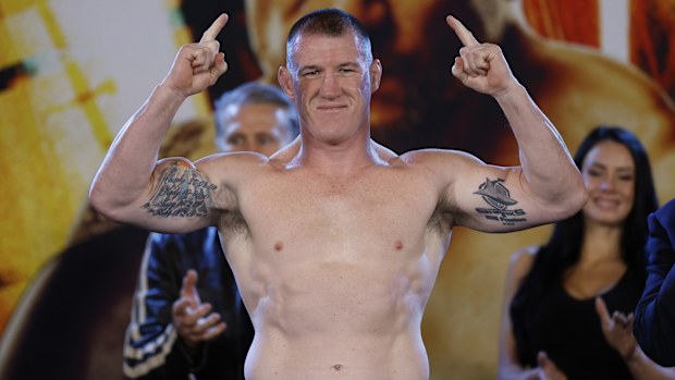 Paul Gallen stands on the scales during his weigh-in at Qudos Bank Arena.