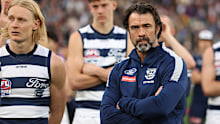 Geelong coach Chris Scott watches on after the Cats were defeated by the Lions in the AFL grand final.