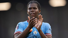 Khadija Shaw of Manchester City applauds fans during their FA Women's Super League match against Manchester United. 