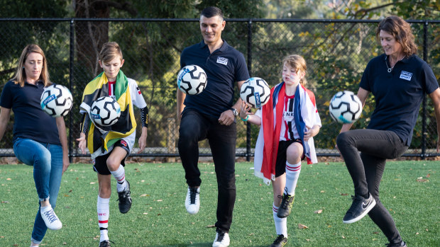 Matildas legends Heather Garriock (left) and Cheryl Salisbury (right) flank Socceroos legend Johnny Aloisi and two North Sydney United juniors juggling a ball at an Optus Sport announcement.