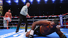 LONDON, ENGLAND - APRIL 23: Tyson Fury (L) knocks-down Dillian Whyte (R) during their WBC heavyweight championship fight at Wembley Stadium on April 23, 2022 in London, England. (Photo by Mikey Williams/Top Rank Inc via Getty Images)