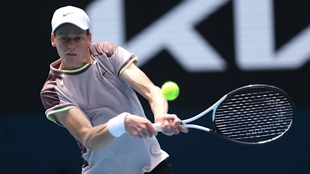 Jannik Sinner of Italy plays a backhand in his round one singles match against Botic van de Zandschulp of the Netherlands at the Australian Open.