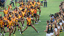 The Indigenous All Stars perform their ceremonial war dance before their AFL exhibition match against the Richmond Tigers at Traeger Park on February 8, 2013 in Alice Springs, Australia.