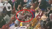 A brawl breaks out in the crowd at Suncorp Stadium during Friday night's Magic Round matches.