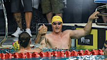 Cameron McEvoy and Kyle Chalmers embrace.
