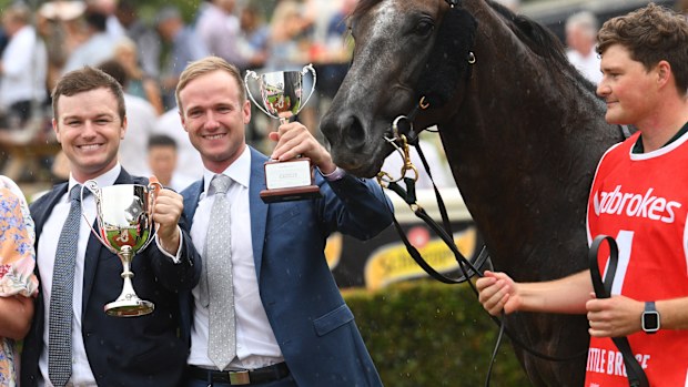 Trainers Ben Hayes and JD Hayes pose with racehorse Little Brose at Sandown Lakeside.