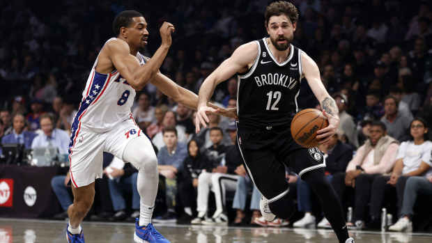 Joe Harris #12 of the Brooklyn Nets dribbles against De'Anthony Melton #8 of the Philadelphia 76ers during the first half of Game Four of the Eastern Conference First Round Playoffs at Barclays Center on April 22, 2023 in the Brooklyn borough of New York City. 