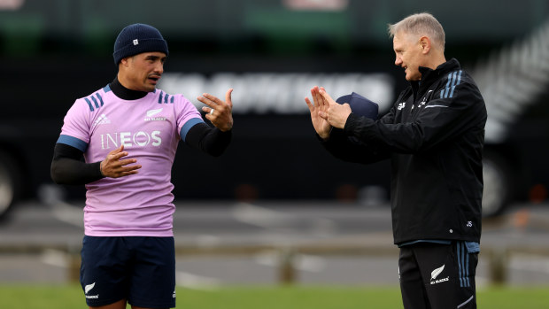 Assistant coach Joe Schmidt talks with Aaron Smith during All Blacks training.