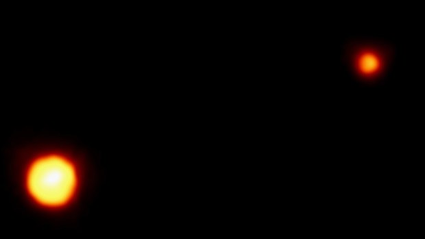 Pluto and its moon, Charon, photographed by the European Space Agency's Faint Object Camera on NASA's Hubble Space Telescope. (Getty Images)