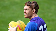 Gary Rohan of the Cats looks on during training.
