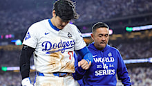 Shohei Ohtani #17 of the Los Angeles Dodgers walks off the field after being injured while attempting to steal second base as they play against the New York Yankees in the seventh inning during Game Two of the 2024 World Series at Dodger Stadium on October 26, 2024 in Los Angeles, California. (Photo by Alex Slitz/Getty Images)