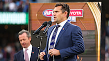 Luke Hodge presents the Norm Smith Medal in 2025.