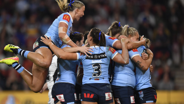 NSW celebrate the opening try of the night against Queensland in the women's State of Origin series opener.