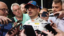 SINGAPORE, SINGAPORE - SEPTEMBER 21: A gaggle of journalists surround Max Verstappen after he gave blunt and short answers to questions in the press conference after qualifying ahead of the F1 Grand Prix of Singapore at Marina Bay Street Circuit on September 21, 2024 in Singapore, Singapore. (Photo by Kym Illman/Getty Images)