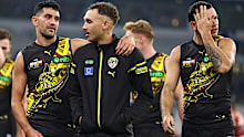 Marlion Pickett and Shai Bolton of the Tigers walk off the field after losing to Essendon in round 11.
