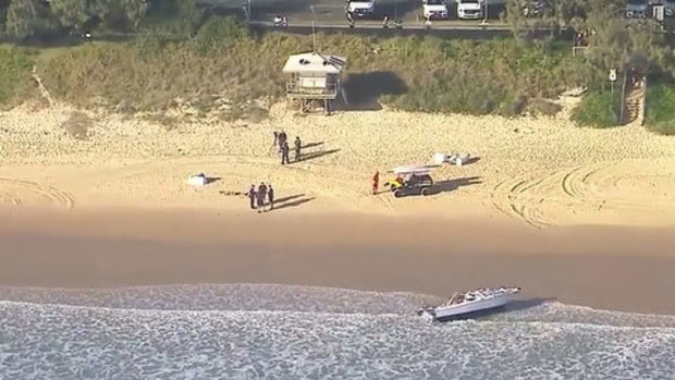 Lifeguards and emergency services at the scene.