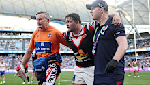 SYDNEY, AUSTRALIA - SEPTEMBER 01: Brandon Smith of the Roosters is helped off the field with an injury during the round 26 NRL match between Sydney Roosters and Canberra Raiders at Allianz Stadium, on September 01, 2024, in Sydney, Australia. (Photo by Cameron Spencer/Getty Images)