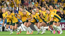 Australia players celebrate victory over France through a penalty shoot out at the FIFA Women's World Cup.