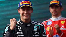 MELBOURNE, AUSTRALIA - MARCH 08: Race winner George Russell of Great Britain and Mercedes AMG Petronas F1 Team on the podium during the F1 Grand Prix of Australia at Albert Park Grand Prix Circuit on March 08, 2026 in Melbourne, Australia. (Photo by Joe Portlock/Getty Images)
