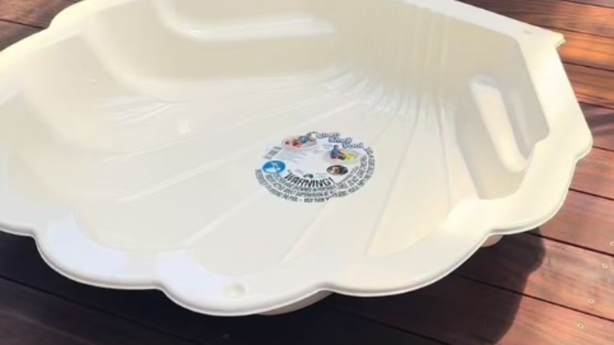 Bunnings' $14 clam shell sandpit and pool for kids in pastel coloues ...