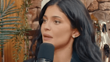 Kylie Jenner shared on Jake Shane's podcast Therapuss about her childhood being followed by paparazzi.