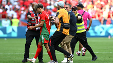 Morocco's Abde Ezzalzouli is followed by pitch invaders during the men's group B match between Argentina and Morocco at the Olympic Games Paris 2024.