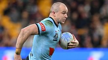 Dylan Edwards of the Blues runs the ball during game three of the 2024 Men's State of Origin series between Queensland Maroons and New South Wales Blues at Suncorp Stadium on July 17, 2024 in Brisbane, Australia. (Photo by Bradley Kanaris/Getty Images)