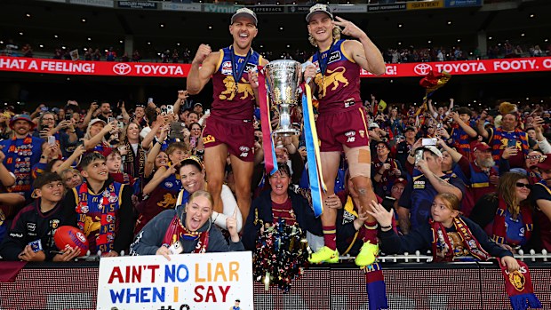 MELBOURNE, AUSTRALIA - SEPTEMBER 27: Kai Lohmann and Will Ashcroft of the Lions celebrates with the trophy after winning the AFL Grand Final match between Geelong Cats and Brisbane Lions at Melbourne Cricket Ground on September 27, 2025 in Melbourne, Australia. (Photo by Daniel Pockett/AFL Photos/via Getty Images)