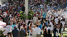 MELBOURNE, AUSTRALIA - JANUARY 18: Fans enjoy the atmosphere inside the park during day one of the 2026 Australian Open at Melbourne Park on January 18, 2026 in Melbourne, Australia. (Photo by Morgan Hancock/Getty Images)