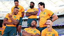 Samu Kerevi, Pete Samu, Marika Koroibete, Scott Sio, Darcy Swain and Nic White share a laugh as they prepare for a Wallabies team photo in July, 2022.