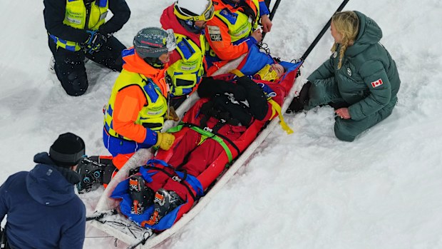 Medical staff load Canada's Cassie Sharpe onto a stretcher after she crashed during the women's freestyle skiing halfpipe qualifications at the 2026 Winter Olympics, in Livigno, Italy, Thursday, Feb. 19, 2026. (AP Photo/Julia Demaree Nikhinson)