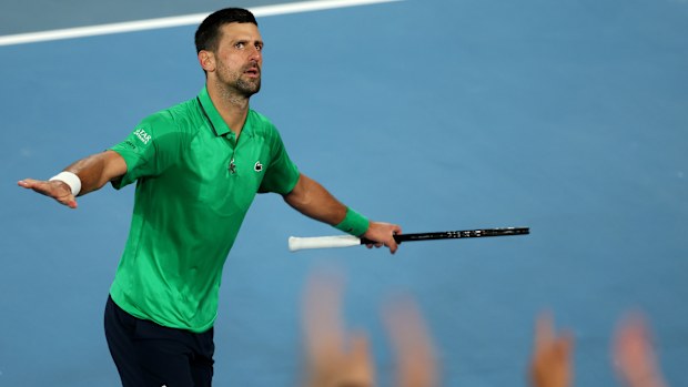 Novak Djokovic celebrates with the crowd after defeating Botic van de Zandschulp.