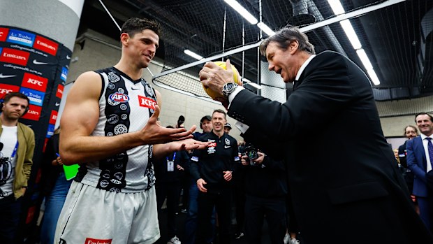 Collingwood President Jeff Browne presents the match ball to Scott Pendlebury of the Magpies after he broke the league record for the most possessions during the 2023 AFL Round 17 match between the Western Bulldogs and the Collingwood Magpies at Marvel Stadium on July 7, 2023 in Melbourne, Australia. (Photo by Dylan Burns/AFL Photos via Getty Images)
