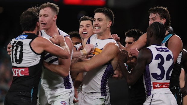 Travis Boak of the Power clashes with Patrick Voss of the Dockers.