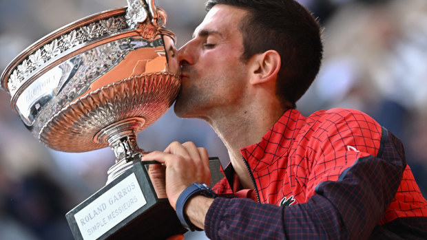 Novak Djokovic of Serbia celebrates with the winners trophy after victory against Casper Ruud of Norway in the Men's Singles Final match on Day Fifteen of the 2023 French Open at Roland Garros on June 11, 2023 in Paris, France.  (Photo by Stephane Cardinale - Corbis/Corbis via Getty Images)