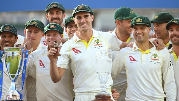 Australian captain Pat Cummins celebrates by lifting the Ashes Urn after successfully retaining the series in 2023.