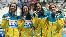 Gold medalists Emma Mckeon, Emily Seebohm, Cate Campbell and Bronte Campbell pose during the medal ceremony for the Women's 4x100m Freestyle Relay at the 2015 FINA World Championships.