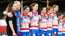 Cropped: Western Bulldogs players line up before the round three AFLW match between the Western Bulldogs and the Fremantle Dockers at Ikon Park on September 09, 2022 in Melbourne, Australia. (Photo by Darrian Traynor/Getty Images)