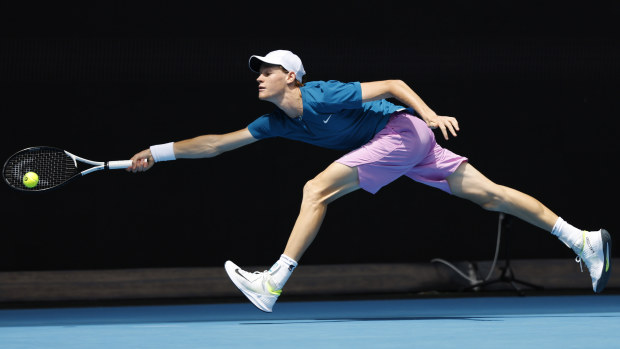 Jannik Sinner of Italy plays a forehand in their round one singles match against Kyle Edmund of Great Britain during day one of the 2023 Australian Open at Melbourne Park on January 16, 2023 in Melbourne, Australia. (Photo by Darrian Traynor/Getty Images)